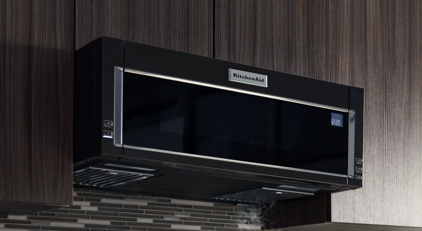 Black, KitchenAid® low-profile over-the-range microwave above tile backsplash Black, KitchenAid® over-the-range microwave above tile backsplash