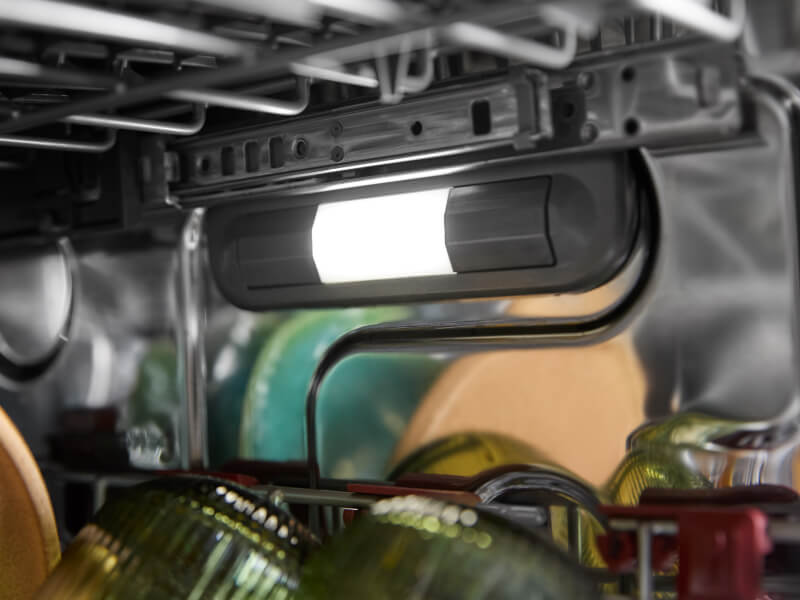 Close-up of lighting inside of a dishwasher