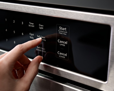Woman starting the self-clean setting