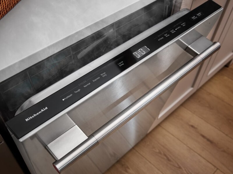 Dishwasher slightly open with steam coming out Dishwasher slightly open with steam coming out