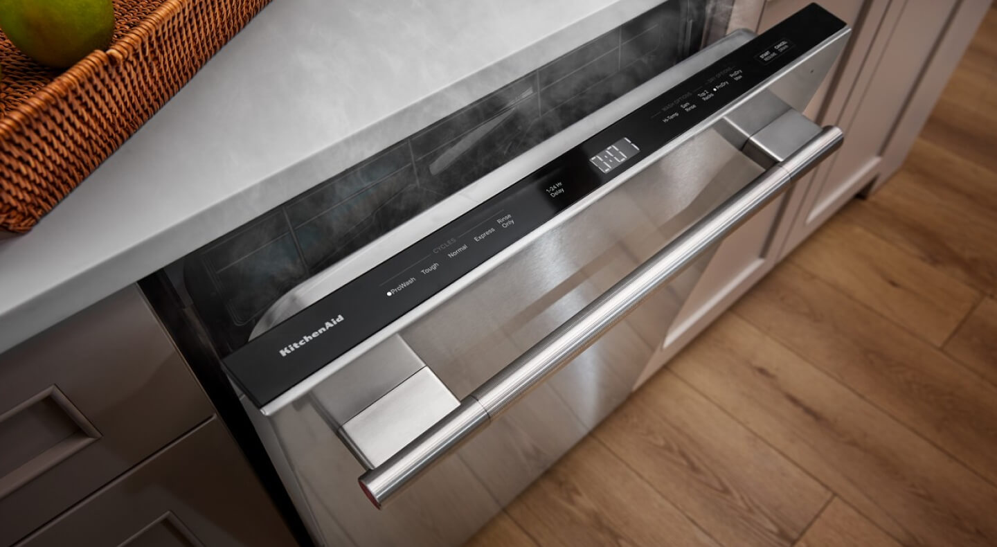 Dishwasher slightly open with steam coming out Dishwasher slightly open with steam coming out