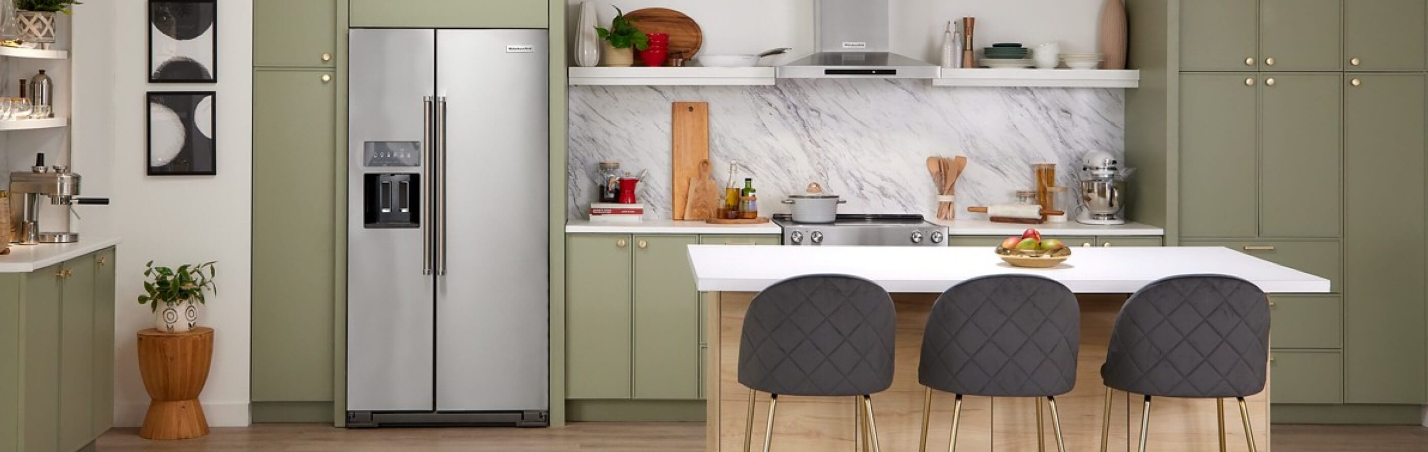 A modern kitchen with a stainless steel side-by-side refrigerator
