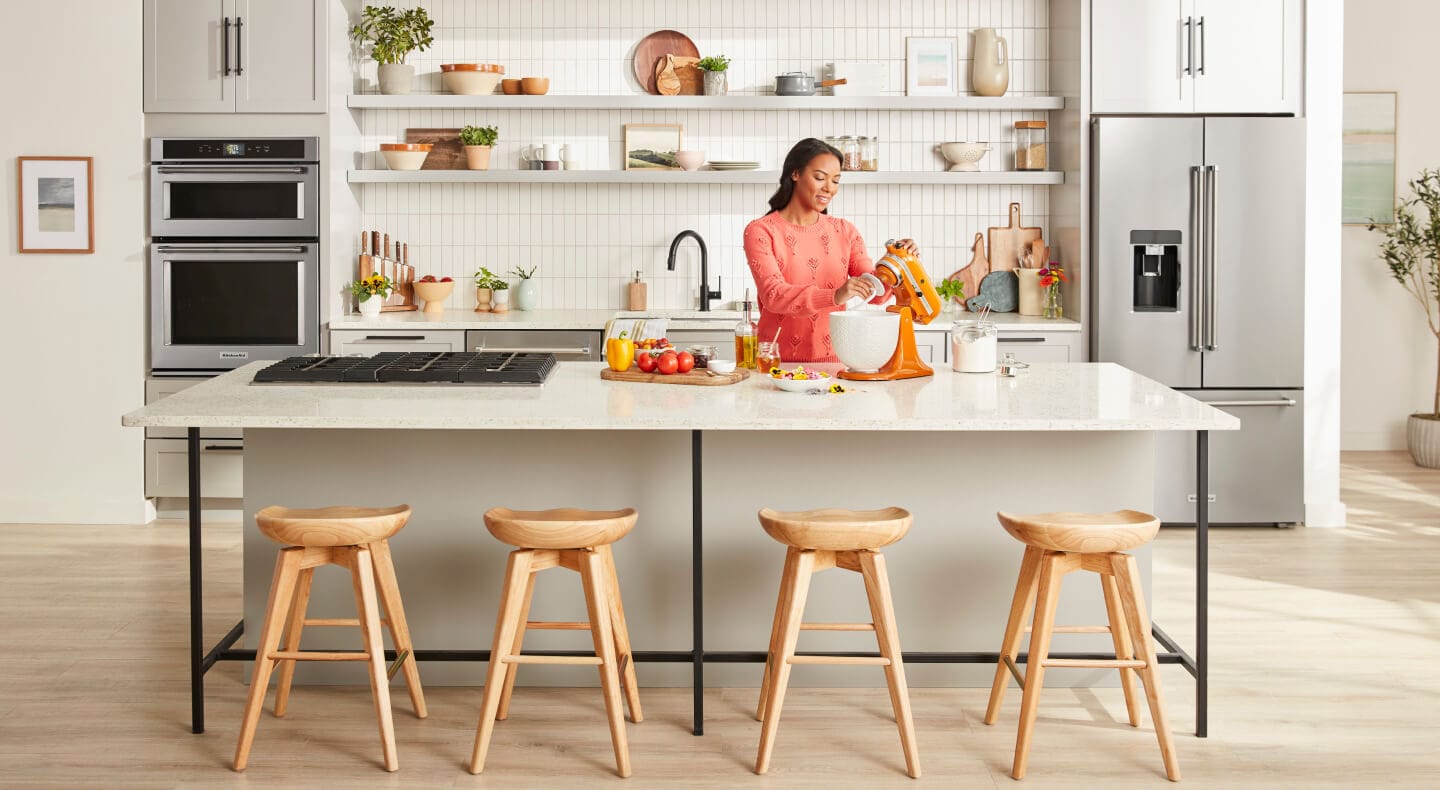 Person baking with a KitchenAid® stand mixer in the kitchen Person baking with a KitchenAid® stand mixer in the kitchen