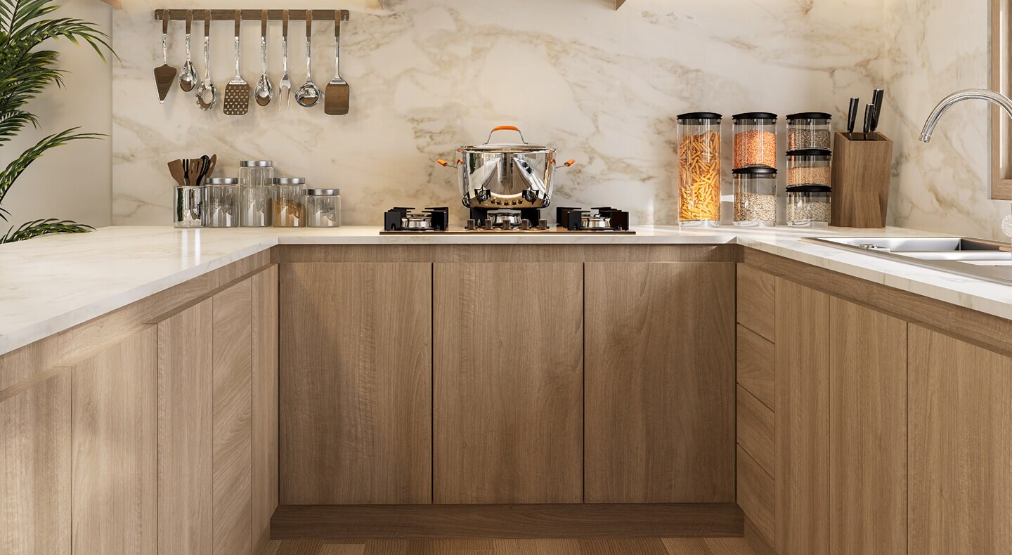 Light brown cabinetry with no handles on cabinets or drawers Light brown cabinetry with no handles on cabinets or drawers