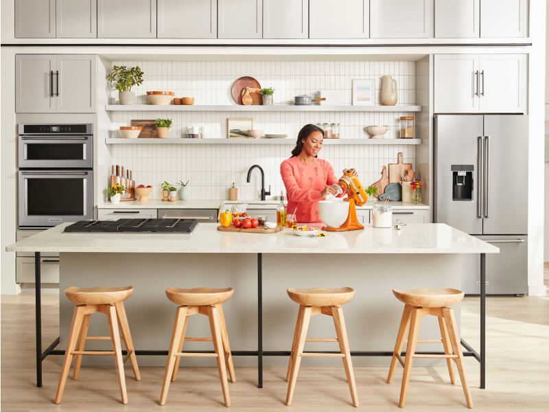 Person baking with a KitchenAid® stand mixer in the kitchen Person baking with a KitchenAid® stand mixer in the kitchen