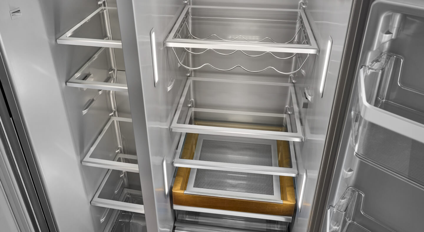 Empty KitchenAid® side-by-side refrigerator with a wine rack Empty KitchenAid® side-by-side refrigerator with a wine rack