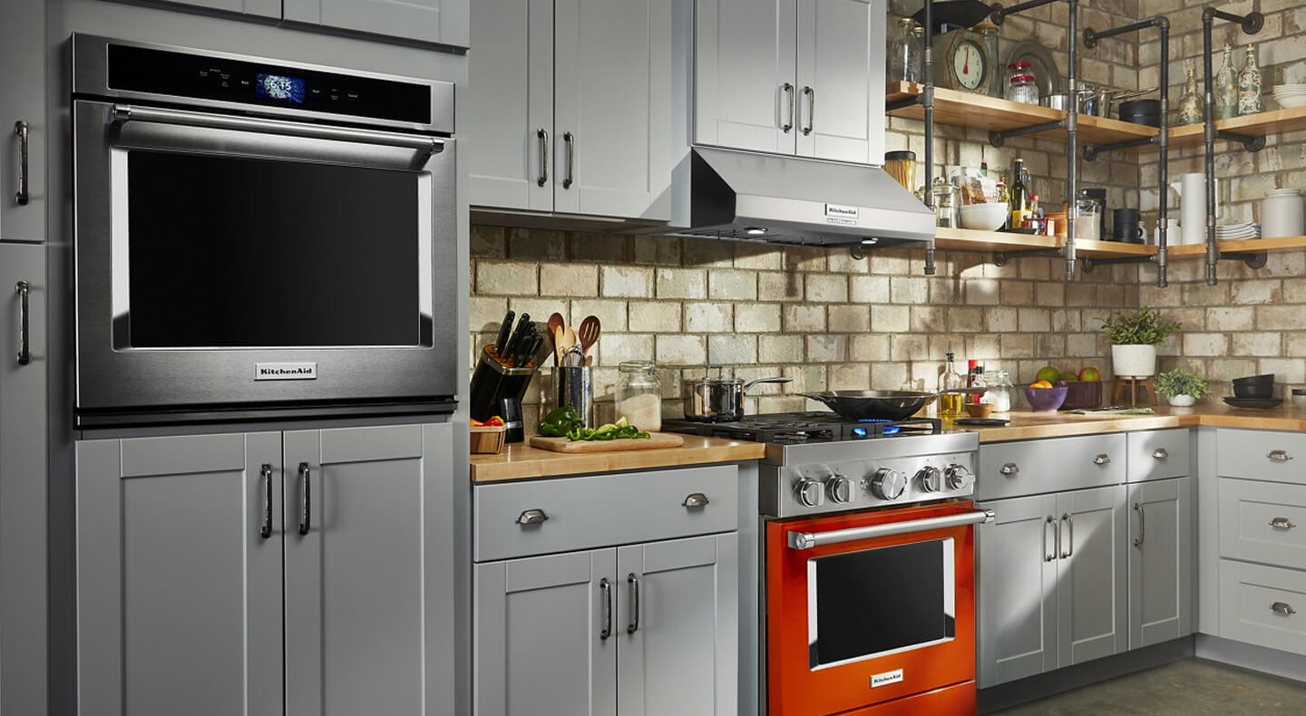 Gray kitchen with KitchenAid® appliances and butcher block countertops