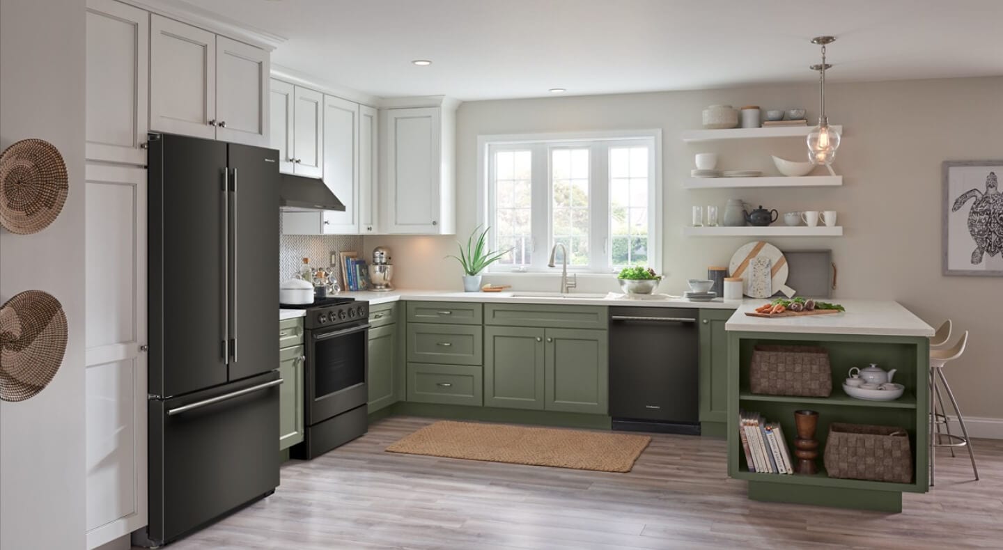 KitchenAid® appliances in a kitchen with green and white cabinets