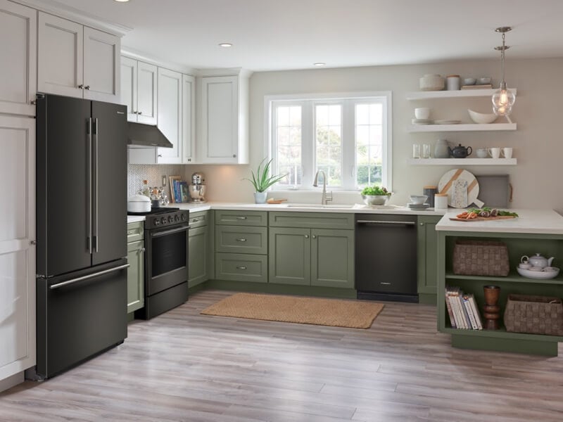 KitchenAid® appliances in a kitchen with green and white cabinets