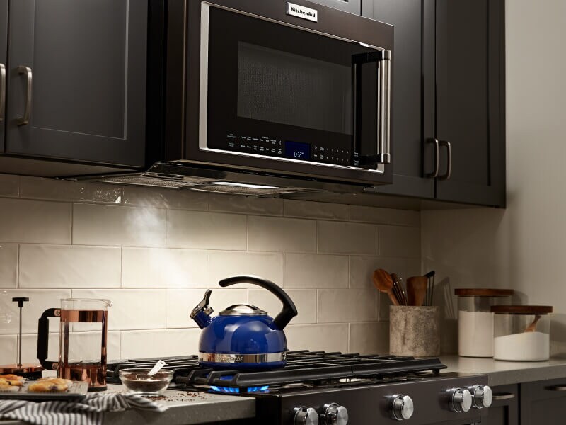 A KitchenAid® over-the-range microwave and oven in a modern kitchen