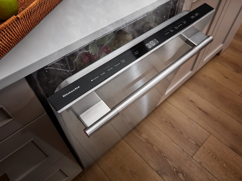 Steam coming out of a propped open KitchenAid® dishwasher