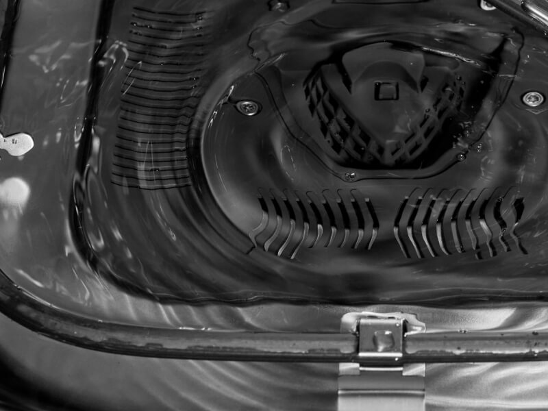 Close-up of the filter at the base of a dishwasher