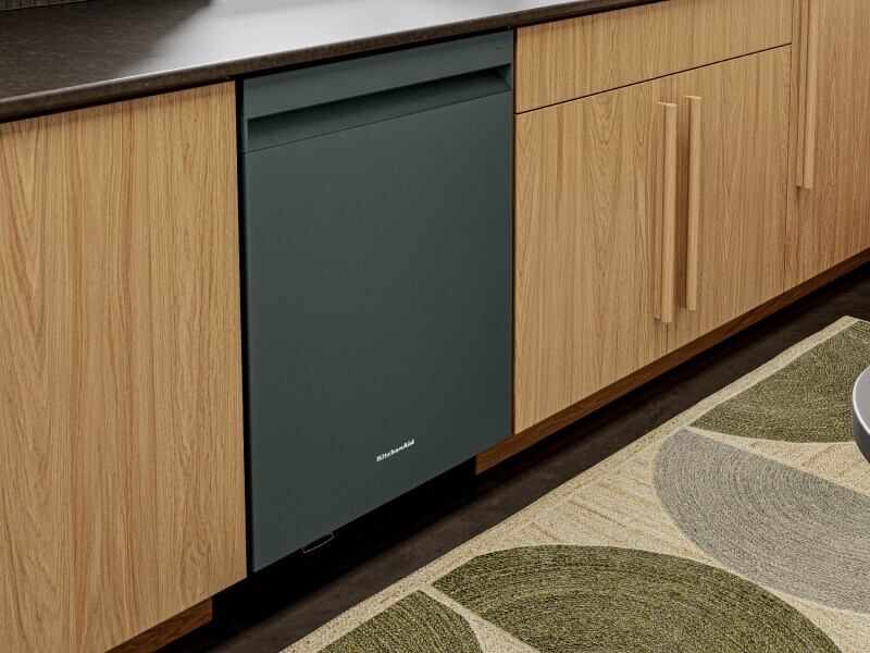 Juniper KitchenAid® dishwasher with a pocket handle in natural wood cabinetry