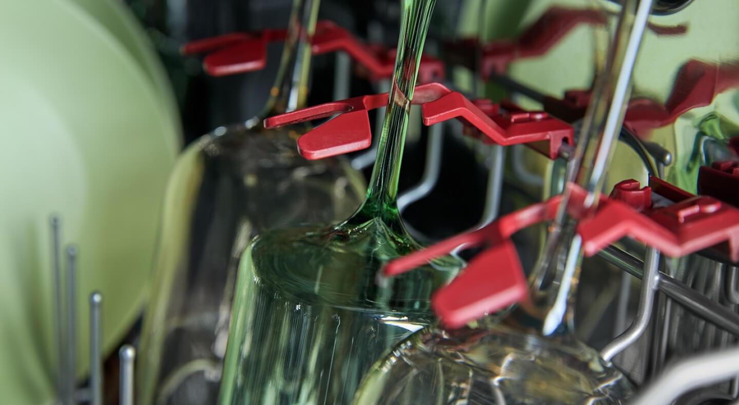 Wine glasses inside a dishwasher