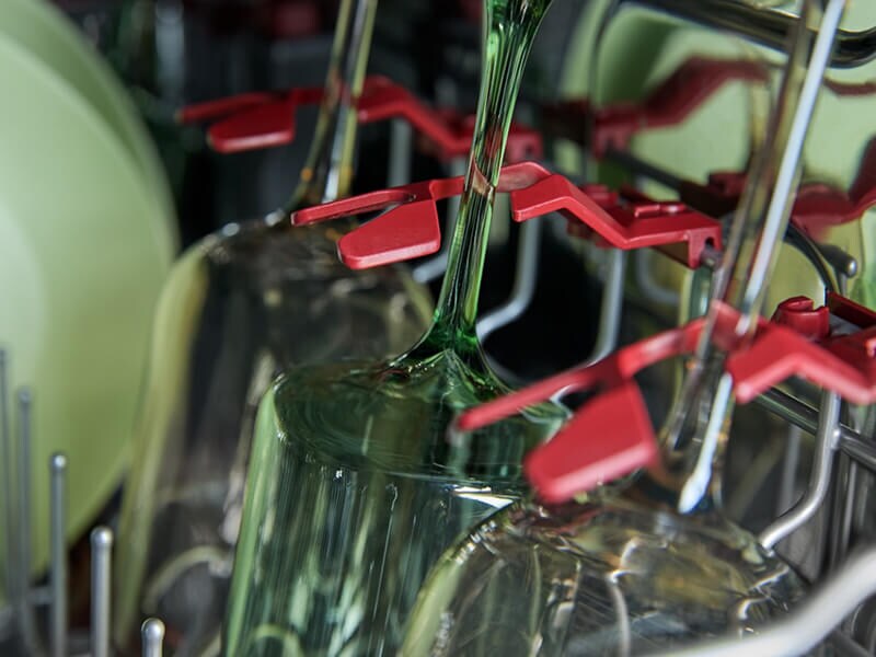 Wine glasses inside a dishwasher