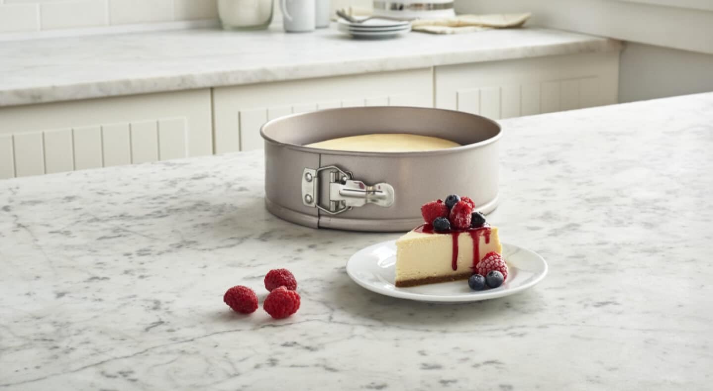 Slice of berry cheesecake on a counter