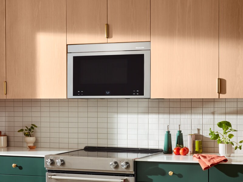 Microwave hood combination over an electric range