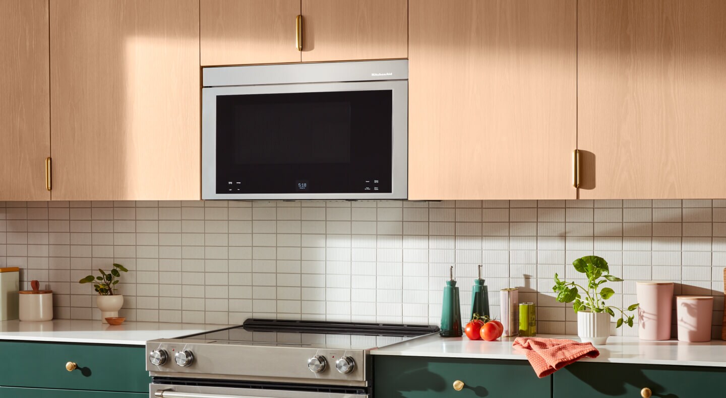 Microwave hood combination over an electric range
