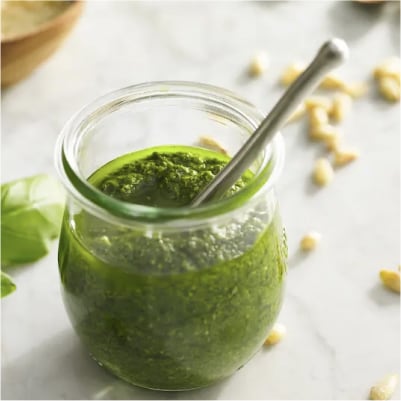 A jar of classic pesto sauce