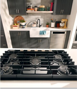 A galley kitchen with a gas cooktop