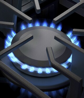Blue flames simmering on a stove