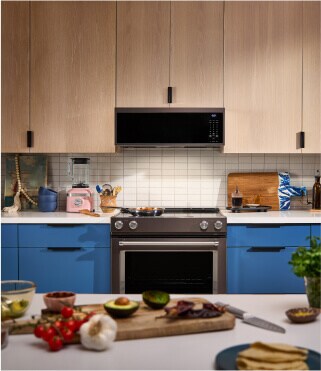 A modern kitchen with blue and brown cabinetry