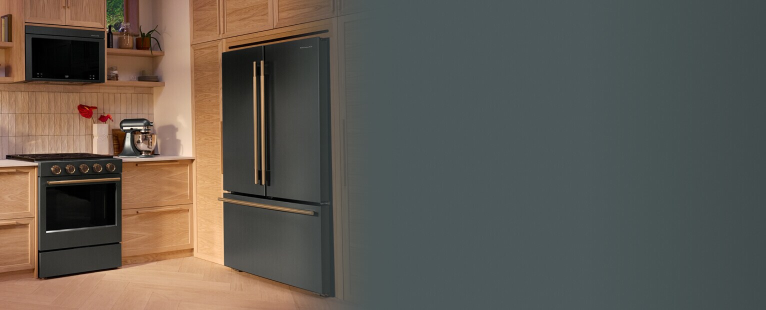 KitchenAid® Juniper appliances in a kitchen with light wood cabinetry