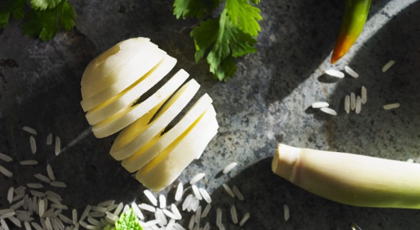Spiral sliced potatoes on countertop with ingredients