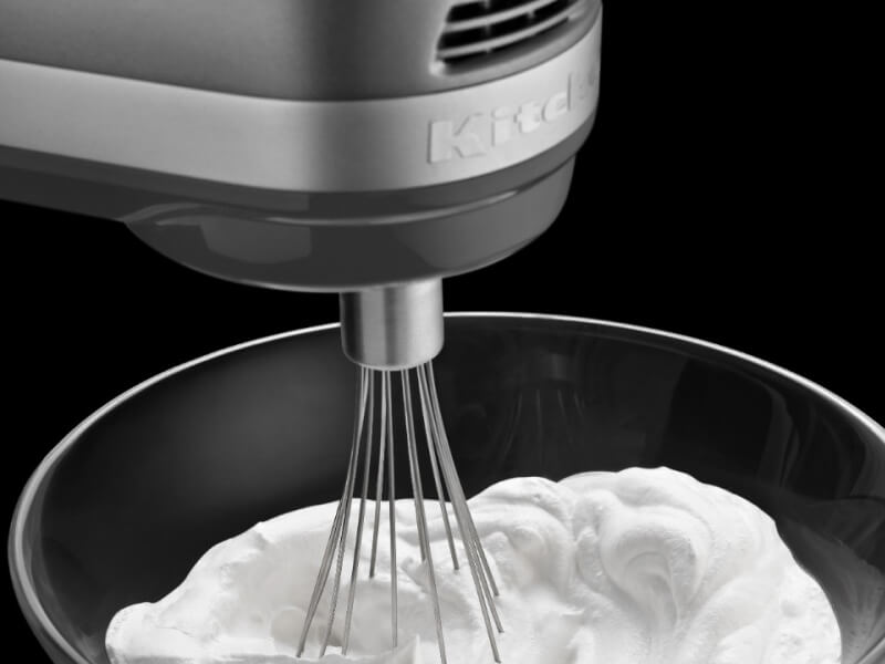 Close-up of cream being whipped with a KitchenAid® stand mixer