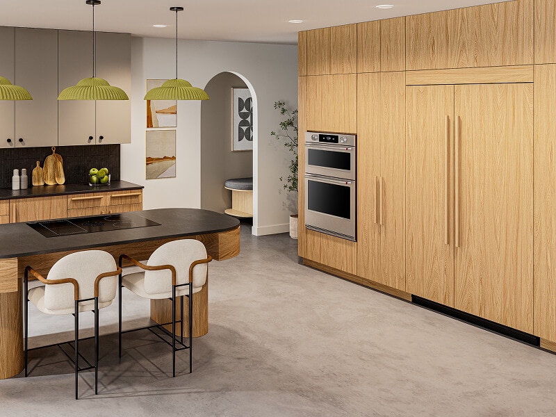 Panel-ready KitchenAid® side-by-side refrigerator blending with wood cabinetr