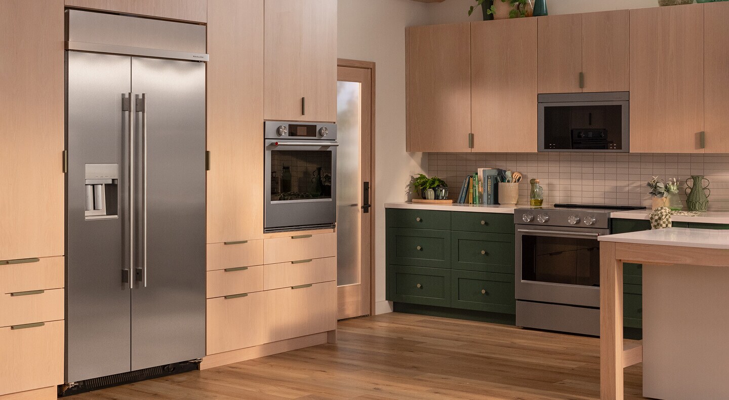 Built-in KitchenAid® side-by-side refrigerator in natural wood cabinetry