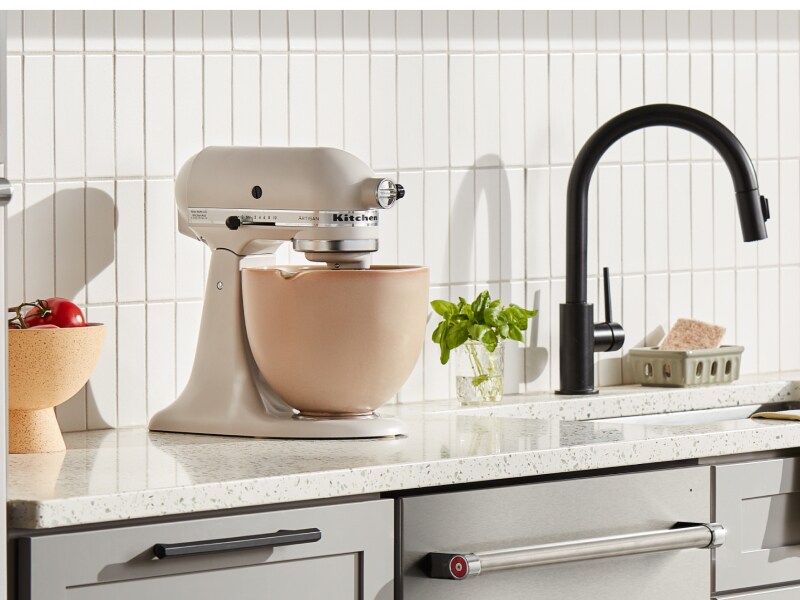Cream KitchenAid® stand mixer with a beige mixing bowl Cream KitchenAid® stand mixer with a beige mixing bowl
