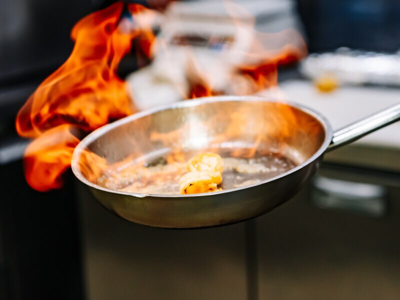 Skillet with food on fire