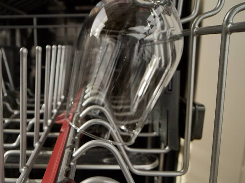 Close-up of wine glass inside a dishwasher