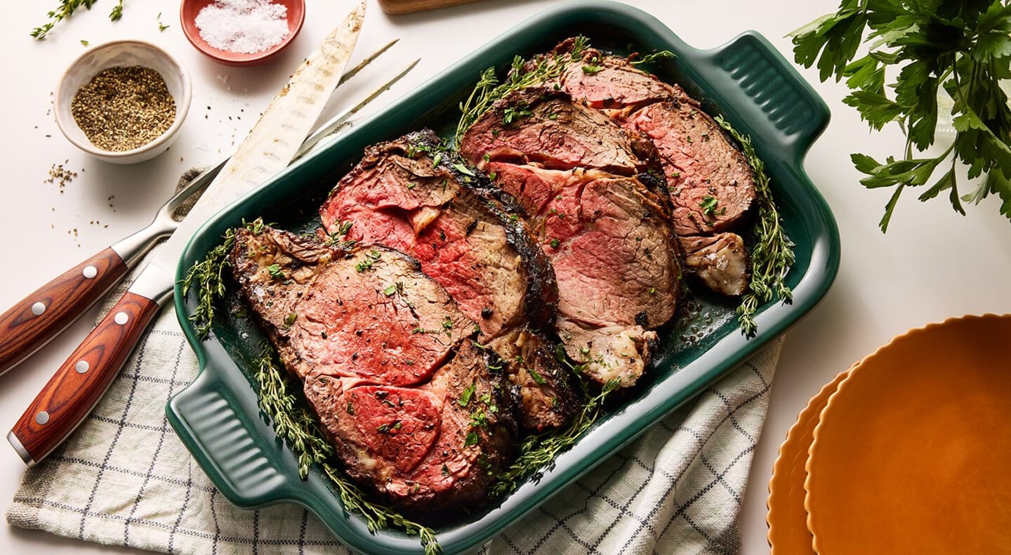 Herb-seasoned meat in a casserole pan Herb-seasoned meat in a casserole pan
