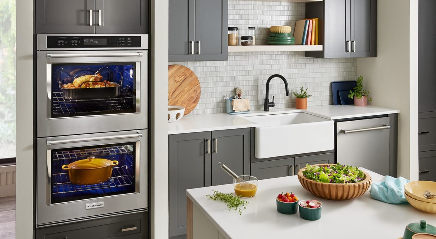 KitchenAid® double wall oven in a kitchen with gray cabinetry and white countertops
