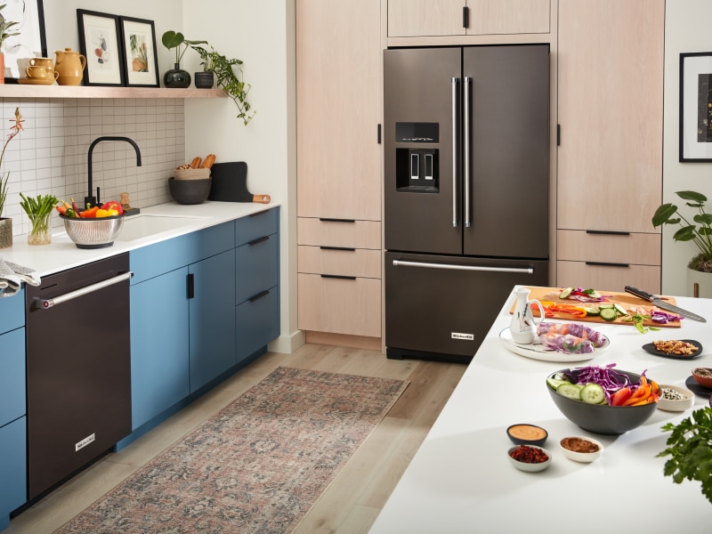 KitchenAid® French-door refrigerator with ice dispenser built into light brown cabinetry KitchenAid® French-door refrigerator with ice dispenser built into light brown cabinetry