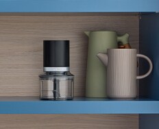 A KitchenAid Go™ Cordless Top Down Chopper on a shelf