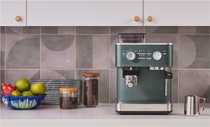 A KitchenAid Espresso Machine against a tiled backsplash