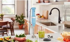 A KitchenAid® Go™ Cordless Top Down Chopper on a kitchen shelf.