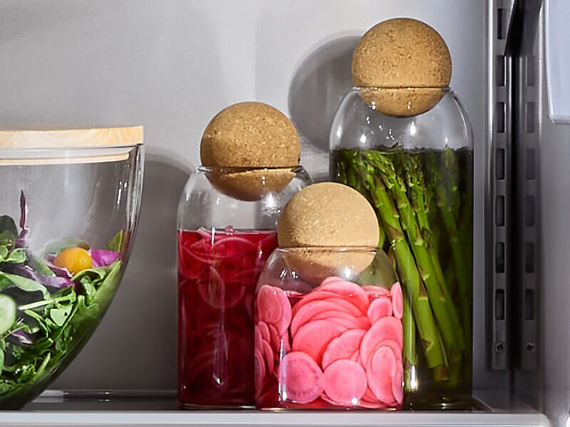 Glass jars full of preserved food