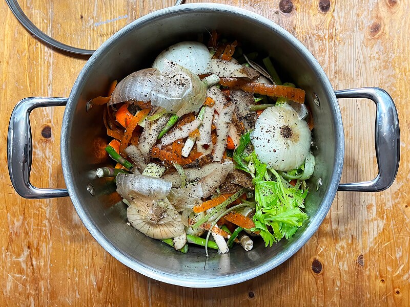 A pot full of vegetable scraps