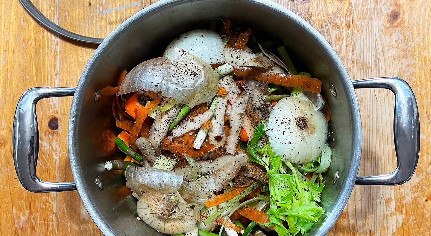 A pot full of vegetable scraps