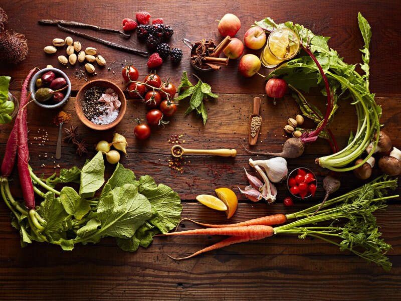 Various root vegetables artfully arranged on a countertop