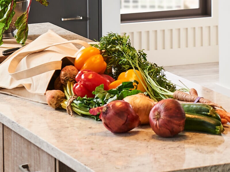 A bag of produce emptied on a countertop