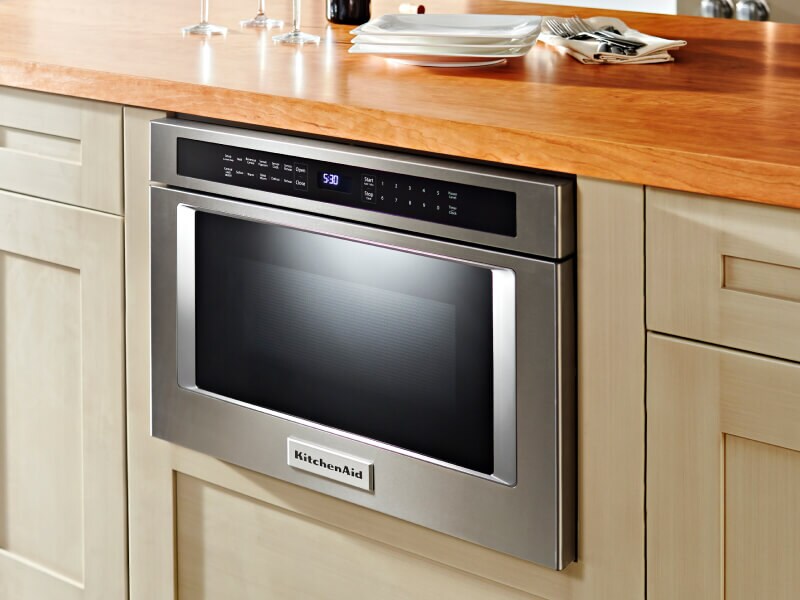 Built-in KitchenAid® microwave beneath wood block countertop