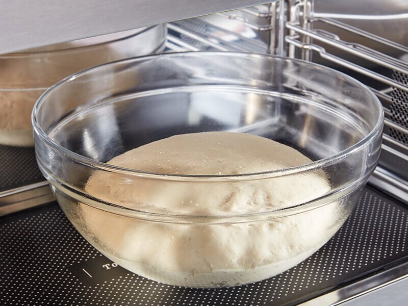 Dough rising in a bowl
