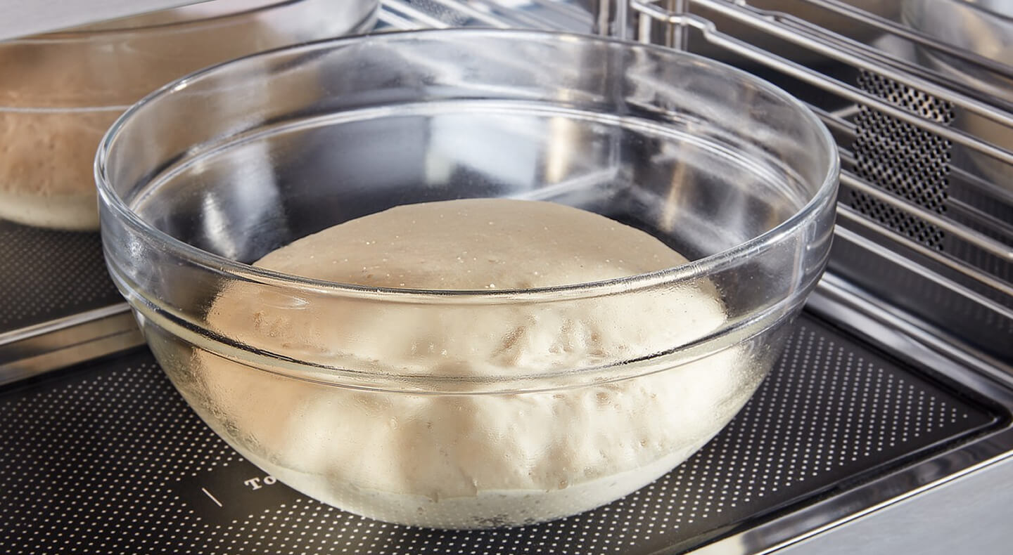 Dough rising in a bowl