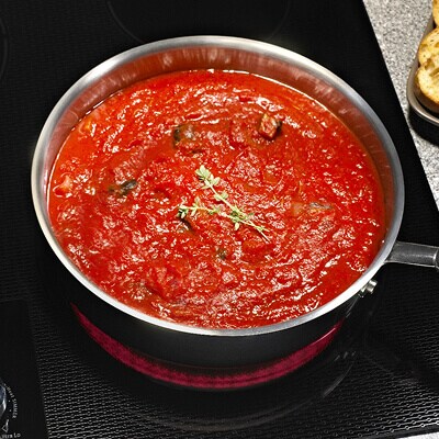 Sauce simmering in a pot on the stovetop