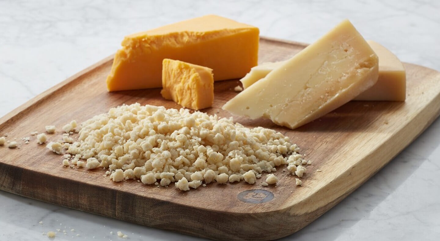 Cheeses on a cutting board